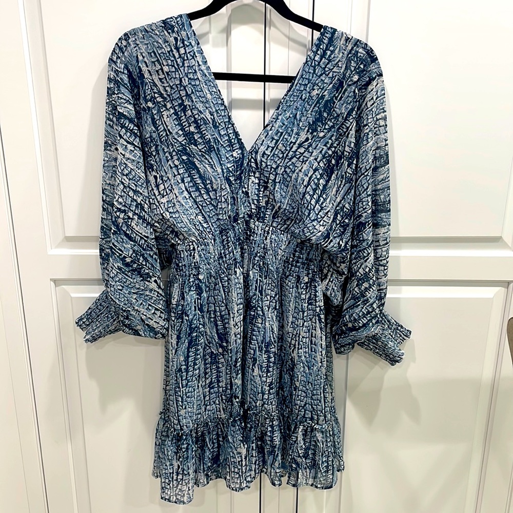 Lovely LOVESTITCH dress, worn one time, it has little silver accents and lined.